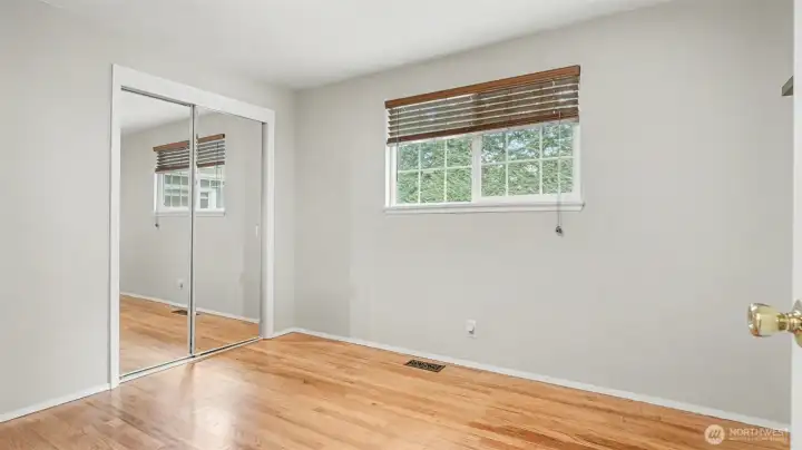 Third guest bedroom, also offering mirror closet doors.