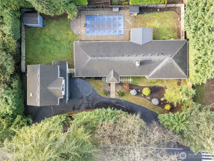 Stunning aerial view showcasing the full expanse and beauty of the property blanketed by greenery and location close to parks & highly rated schools.