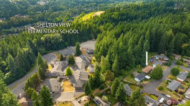 Shelton View Elementary is blocks away! White arrow indicates where the home is