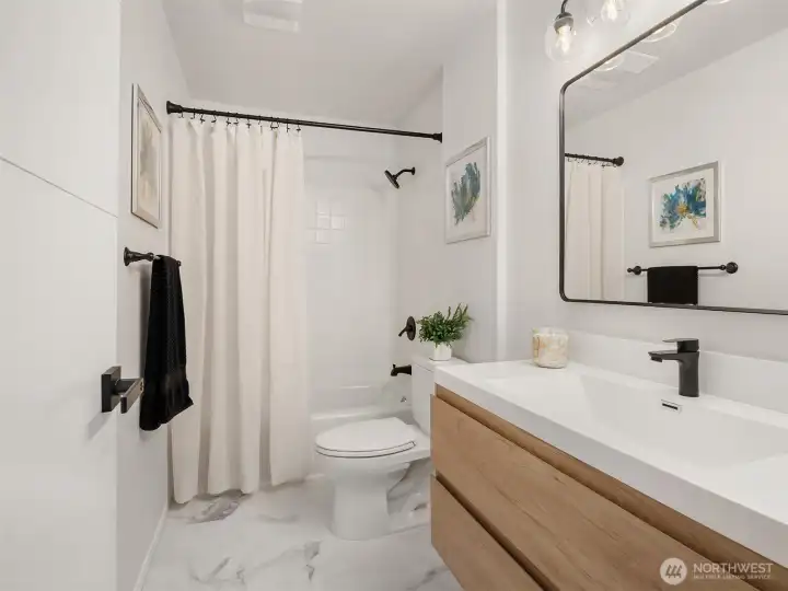 Remodeled full bathroom on the lower level.