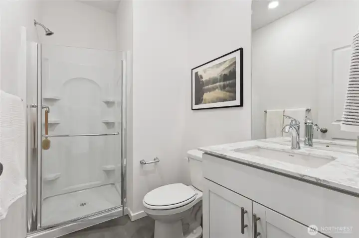 Bath down with walk-in shower. Great for guests.   Pictures are for representational purposes only, colors and features may vary.