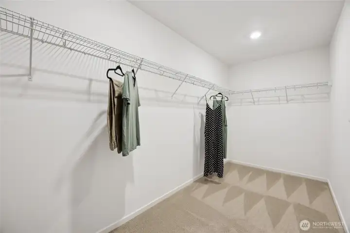 Large walk-in closet in the primary.   Pictures are for representational purposes only, colors and features may vary.