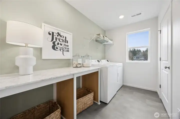 Desirable counterspace in the laundry room. Window to really open up the space as well.   Pictures are for representational purposes only, colors and features may vary.