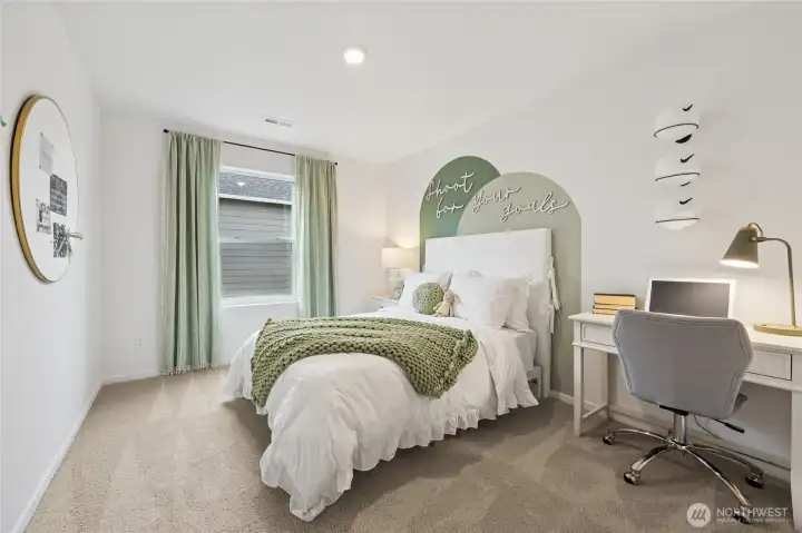 Additional bedroom up featuring a walk-in closet.   Pictures are for representational purposes only, colors and features may vary.