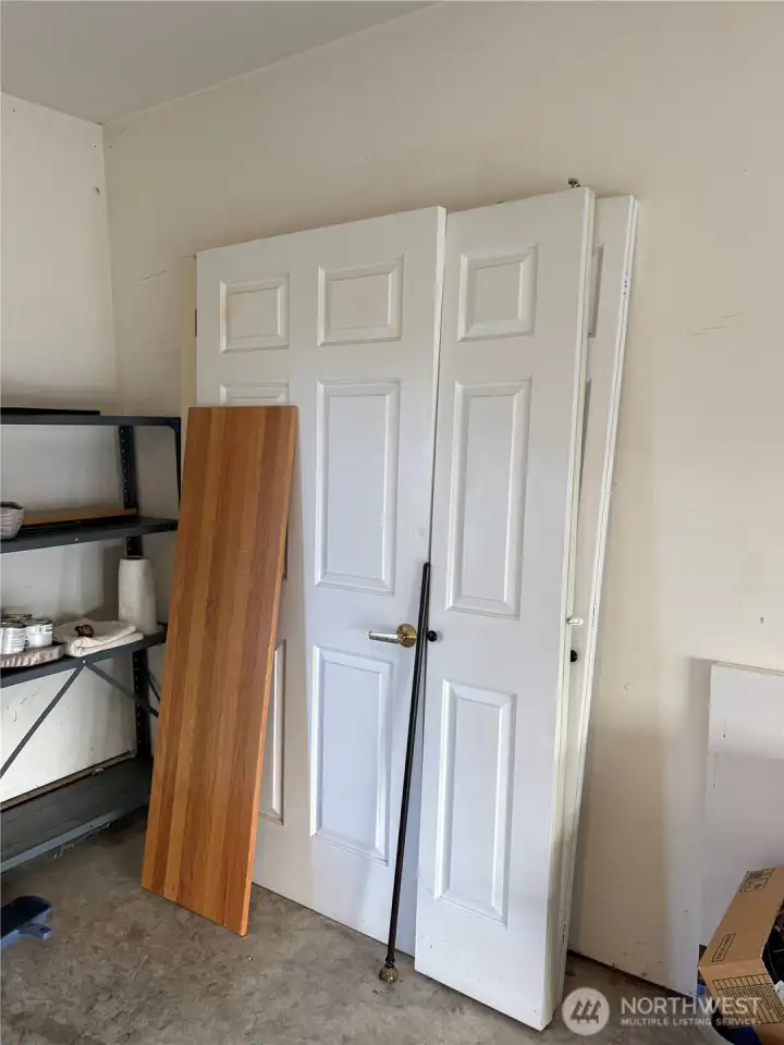 The missing doors for the laundry and 2nd bedroom are being stored in the garage.