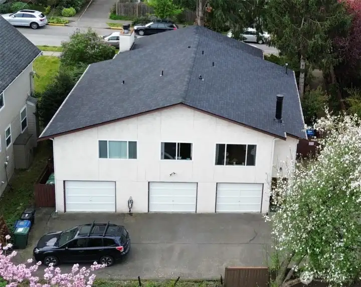 Brand new roof, gutters and downspouts, newly painted garage doors