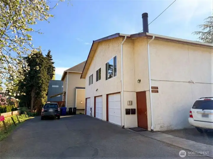 Three oversized garages, driveway, additional parkings. Newly painted garage doors and entrance door. Brand new roof, gutters and downspouts.