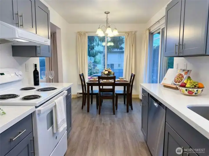 8850 bright kitchen and dining area with sliding door to the deck