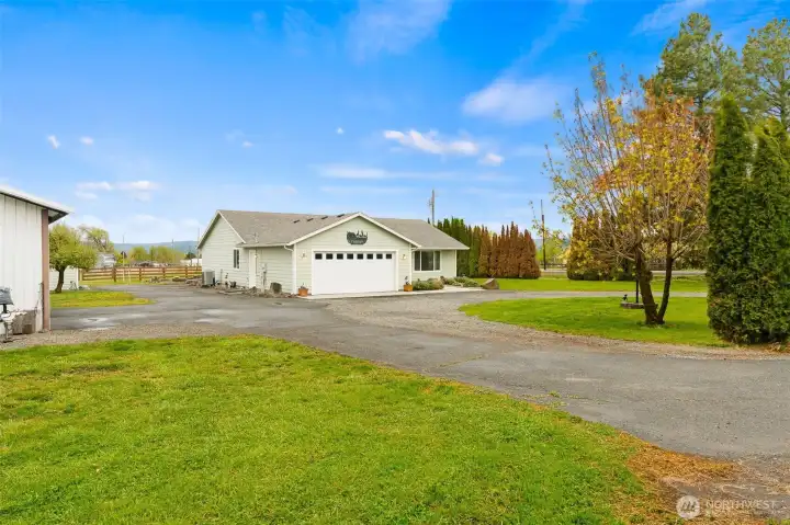 Circular drive with shop/barn off to the left