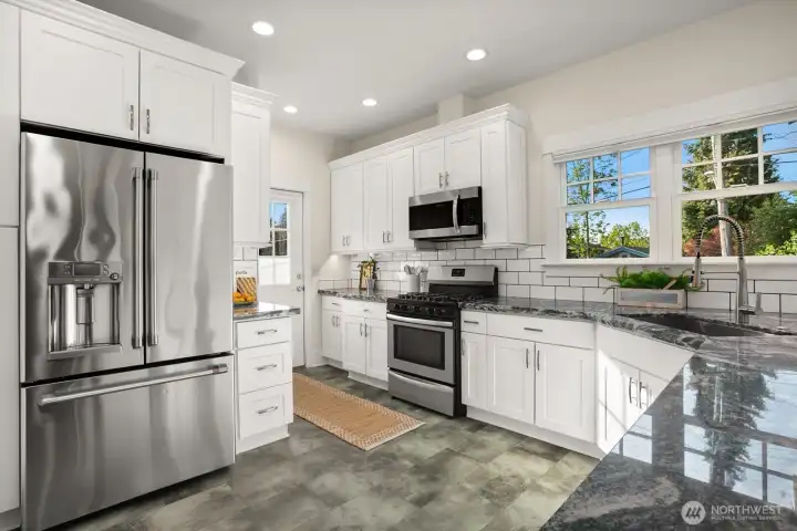 Remodeled kitchen with shaker cabinets, granite counters and subway tile, stainless steel appliances, timeless design!