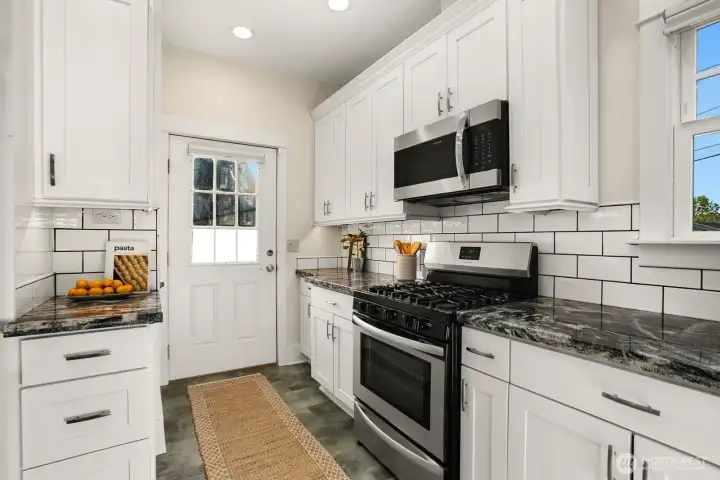 Backdoor leads to the upper back deck.