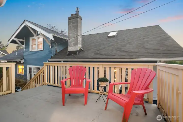 Upper back deck off the kitchen with stairs down to a lower patio as well.