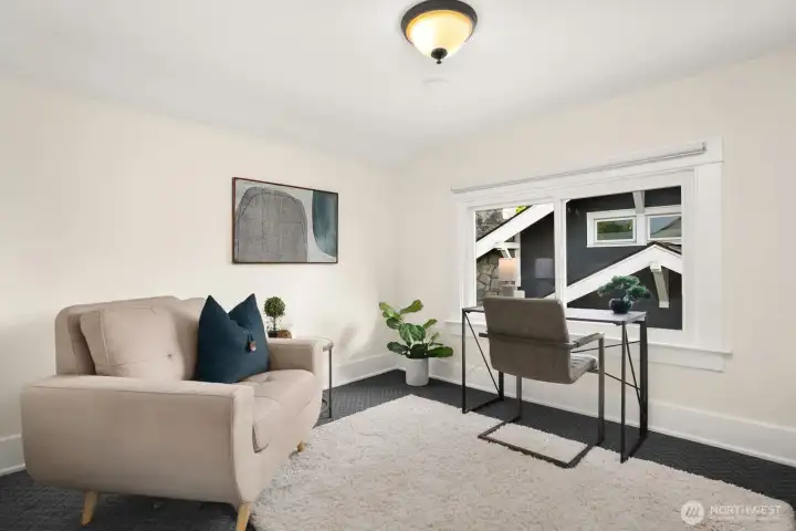 Other bedroom upstairs set up as a reading/work space.