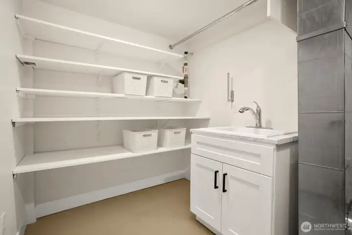 Laundry/Utility room with sink and storage