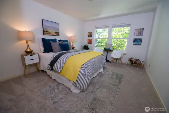 This bedroom is nice and big with a walk in closet