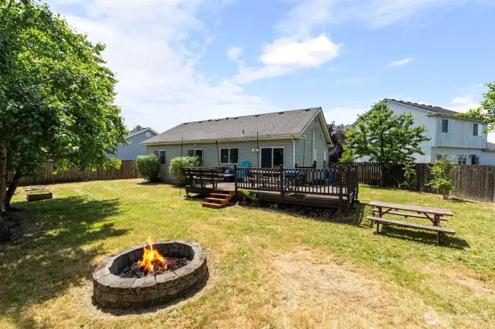 Large backyard with a firepit