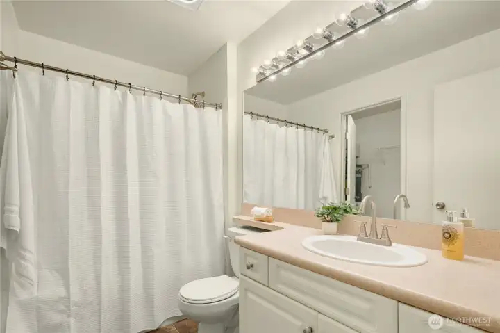 Primary bathroom with walk-in closet off.