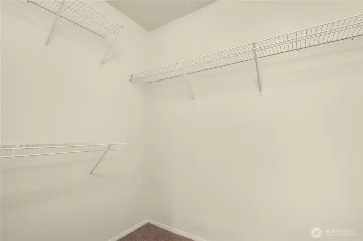 Walk-in closet in primary bedroom.