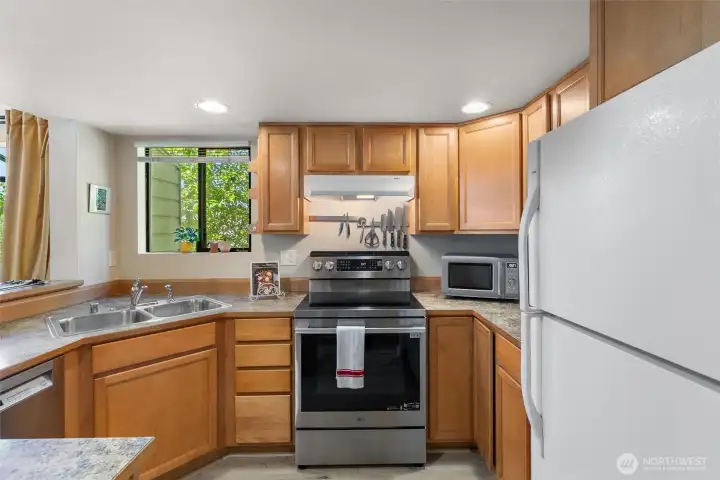 Kitchen features new stove/range. And almost new dishwasher.