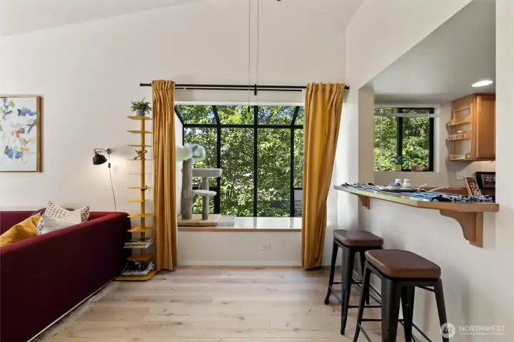 Dining area features a solarium window with deep bench. Use this for a reading nook, plant sanctuary, cat corner, or whatever your heart desires!