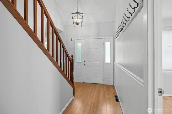 Looking toward the front door of the home. Primary bedroom is on the right in this photo