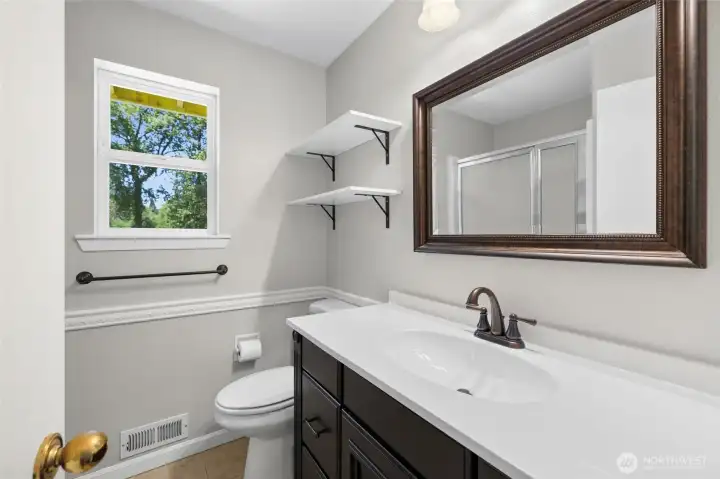 Upper level bathroom with stall shower