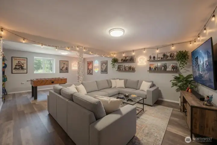 Basement bonus room with access to the garage and back yard.  Virtually staged