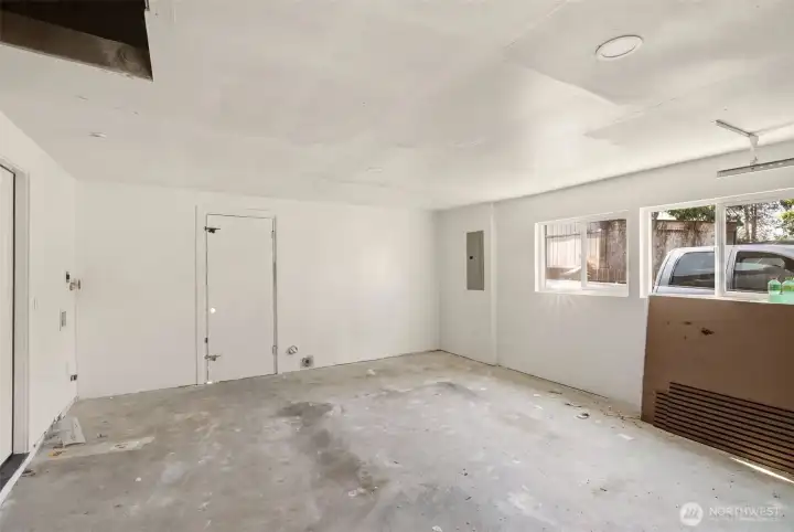 Garage with access door to backyard. Garage with access door to backyard.
