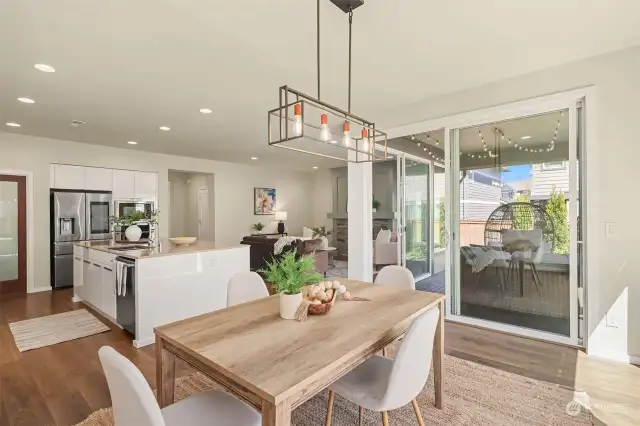 Spacious dining area, surrounded by windows. This home is filled with natural daylight.