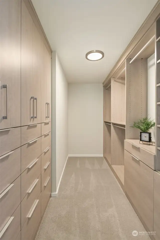 This closet space is incredible. So much hanging and drawer space as well as dual pull out laundry hamper cabinets on the right hand side. You will be impressed!