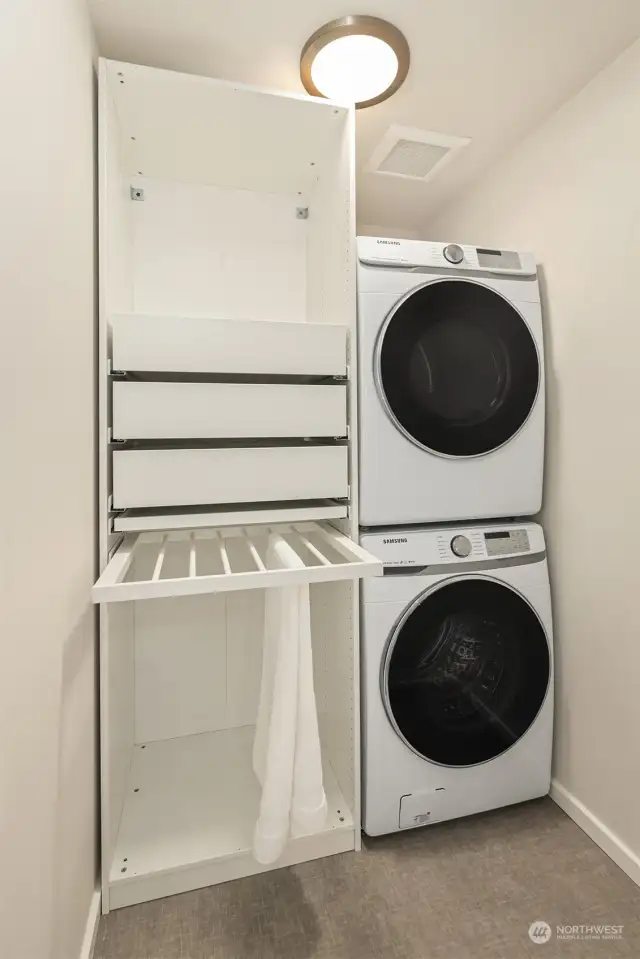 Seller upgraded the laundry room adding cabinet space and rehanging the doors to they open outwards, making this a spacious and welcoming space to do laundry.