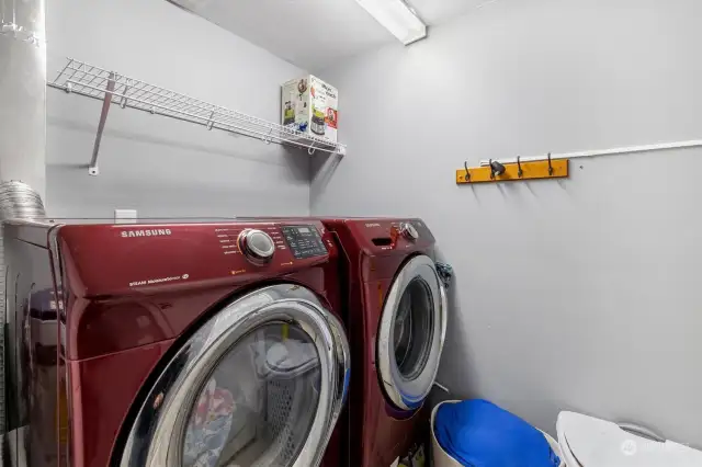 A sizable laundry room leads to the backyard.