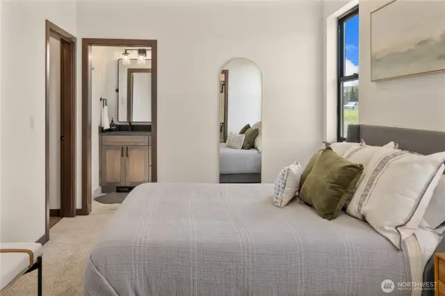 Primary suite, located on the main floor. This photo is of the model home.