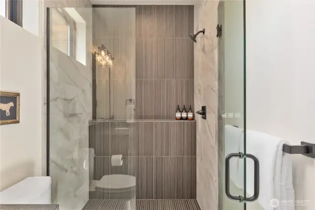 Shower in primary bath. Finishes, fixtures, etc. may vary.