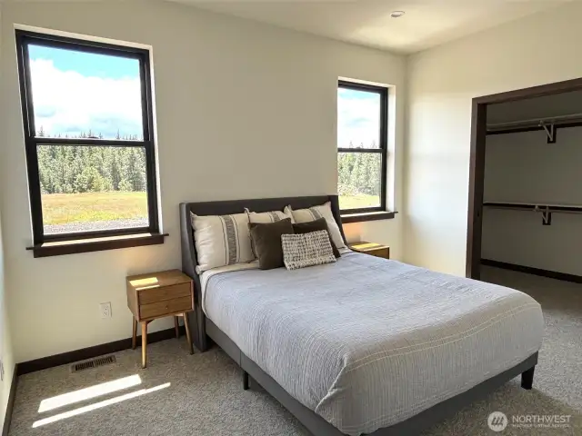 Primary suite, located on the main floor. This photo is of the model home.