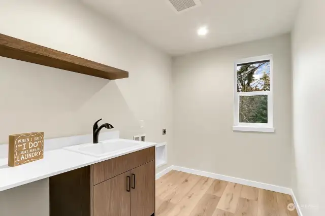 Laundry room on the upper level close to the bedrooms.