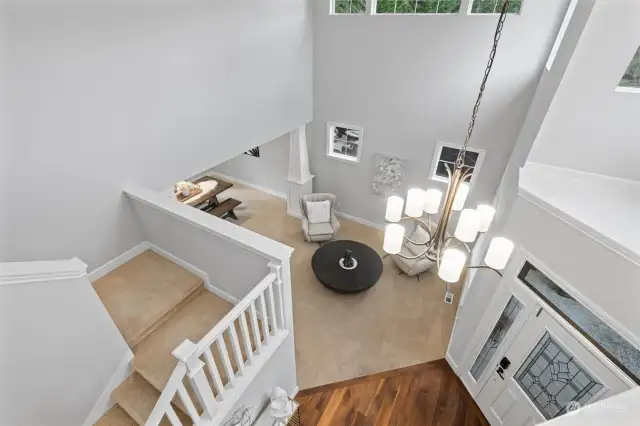 An open staircase accentuates the flow of the space, while chic half pony walls make the layout feel larger & more contemporary. A spacious upstairs landing with pony walls invites natural light & provides an open view to the lower floors for a more connected living experience.