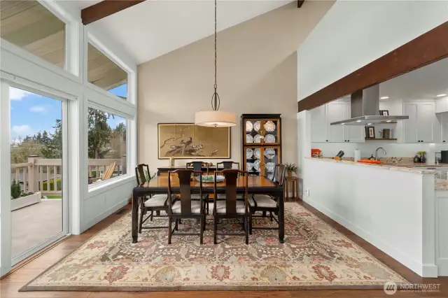 Dining room with vaulted ceiling.