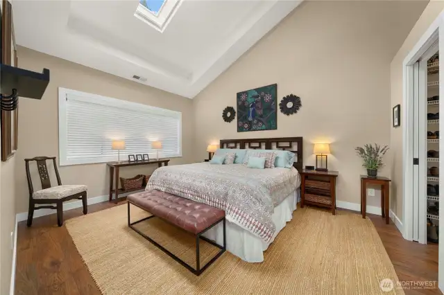 Primary bedroom with vaulted ceiling, skylight and ensuite.