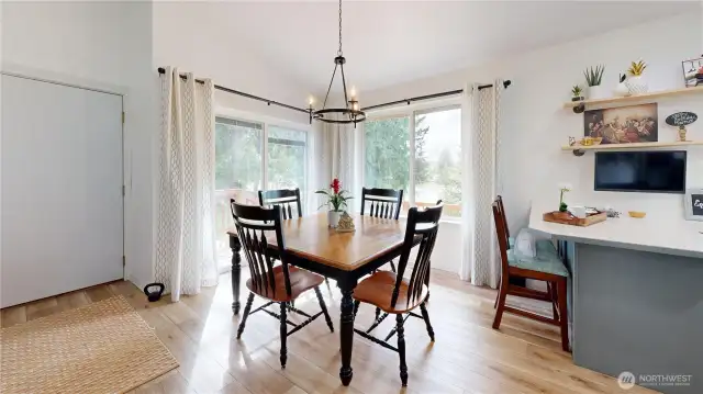 Dining area off of kitchen has a water view