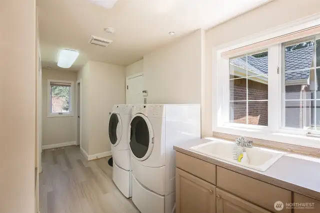 Laundry room on the main level with laundry sink/dog wash as well as a “drip-dry” sink for your delicates