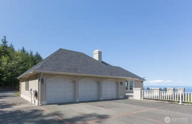 Three car garage has plenty of storage and place for your water toys