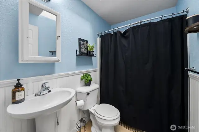 Full main bath serves bedrooms two and three nicely.