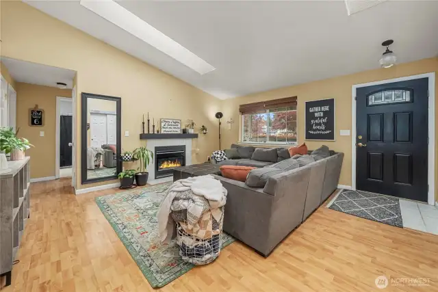 As you enter the home you are greeted by light hardwood floors.