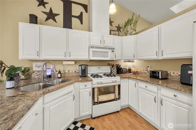 Gorgeous granite countertops complement the kitchen.