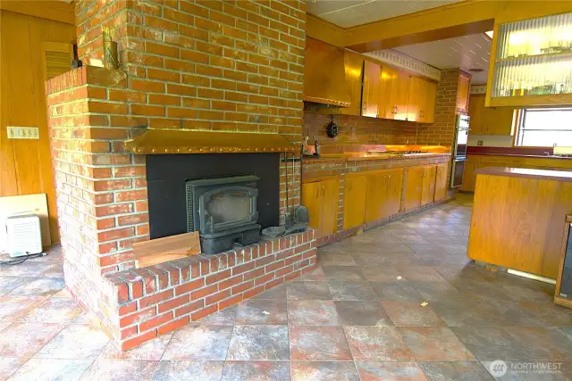 second fireplace off of kitchen and into dining room or den space