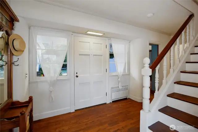 The moment you step inside this home, you're surrounded by custom handcrafted wood finishes and details that never cease to impress. Notice the recessed radiator.  Thoughtful touches like this greet you at every turn.