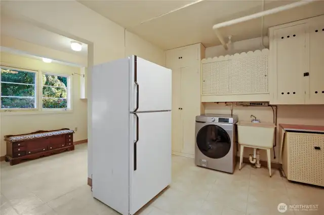 Enormous Utility room, laundry room, and pantry.  All appliances stay, including the extra refrigerator and new microwave. In here you will also find the furnace that has been maintained and inspected.