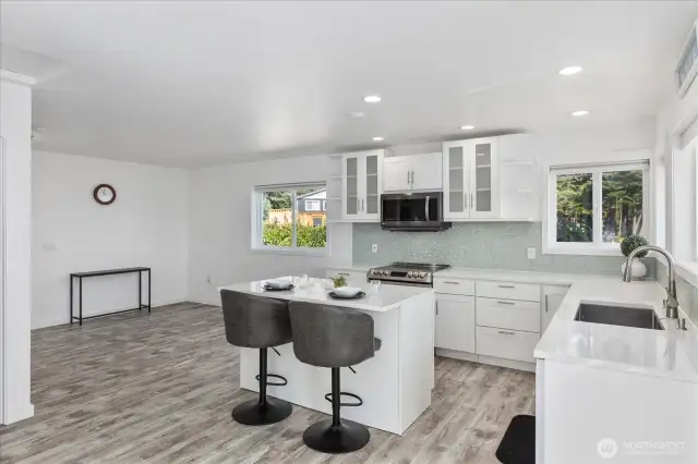 Looking from the French doors and living room area towards the kitchen and dinning room.