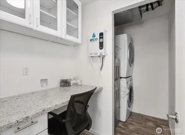 Laundry room with desk/office space.